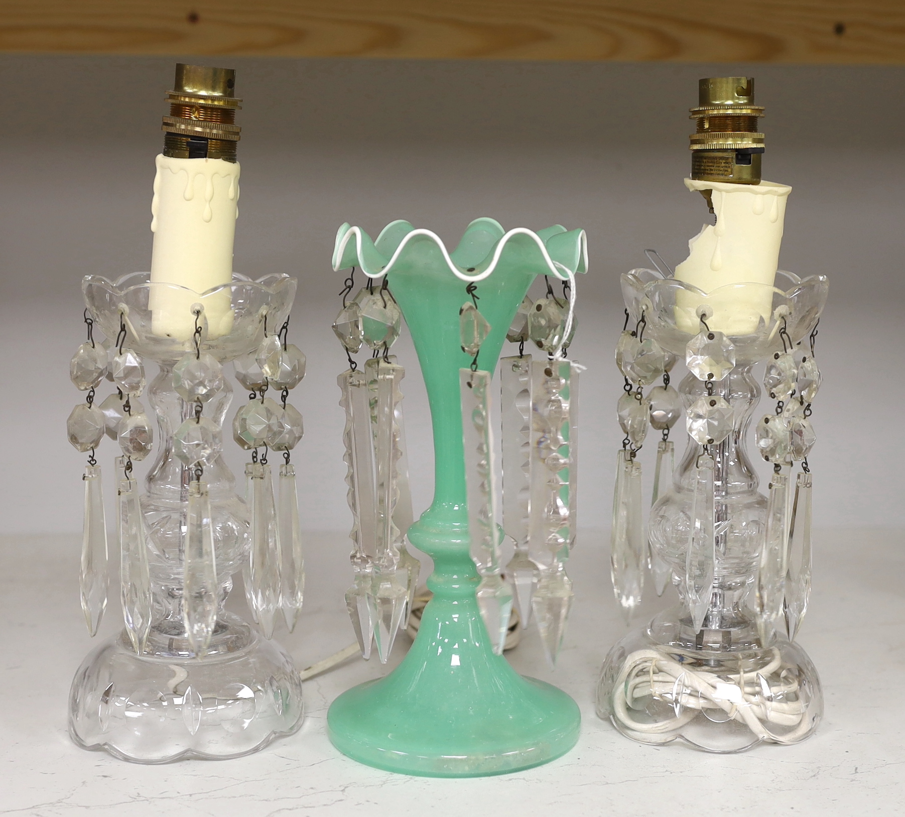 A pair of cut glass lustres and another, tallest 22cm